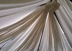 Tented a conservatory roof with lining fabric, helps to keep the heat out and makes it feel more...
